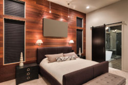 modern-master-bedroom-with-rich-wood-accent-wall-sept11
